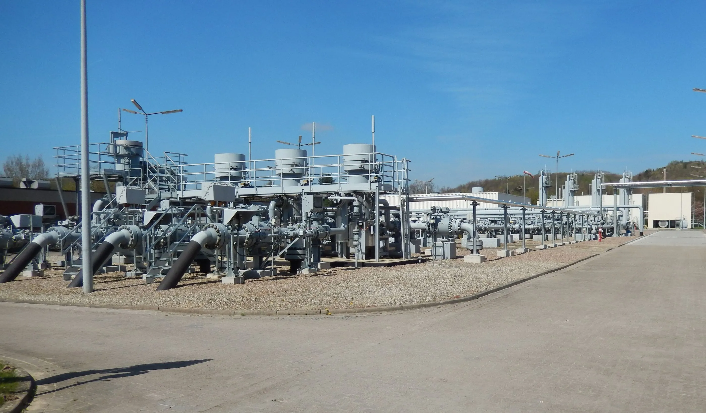 Pipework and compressor units at a gas storage site.